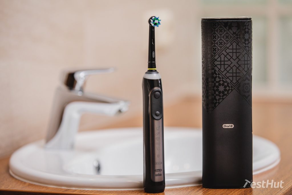 Electric toothbrush Oral-B Genius X next to a sink
