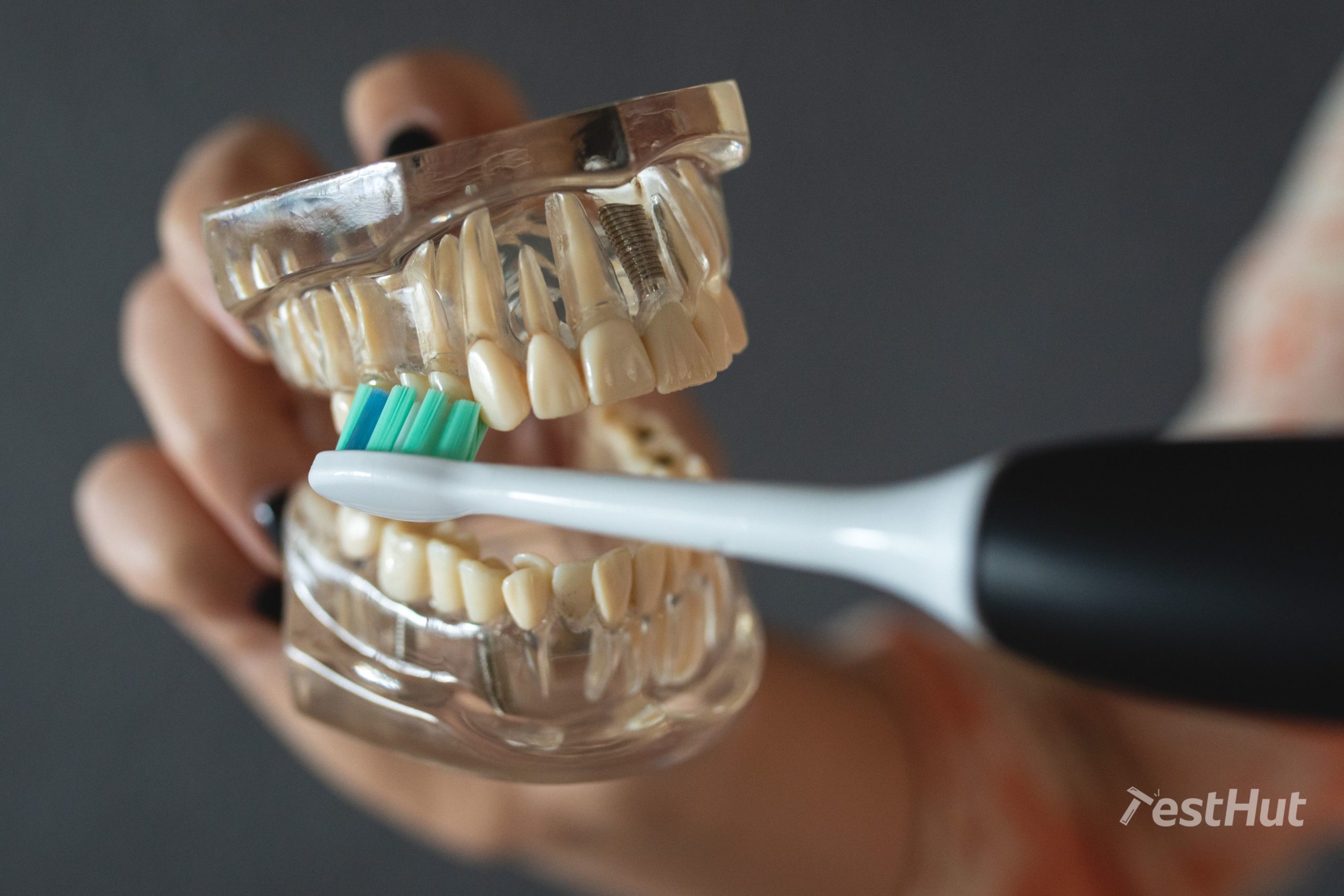 https://www.testhut.com/uk/wp-content/uploads/sites/9/2021/11/Cleaning_teeth_featured-1-scaled.jpg